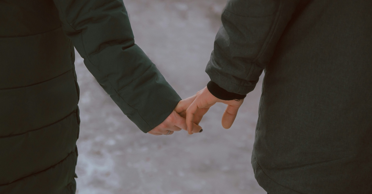 Man and woman holding hands